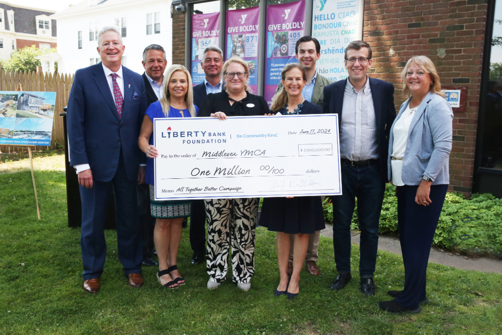 Group of people with a $1 million check to the YMCA